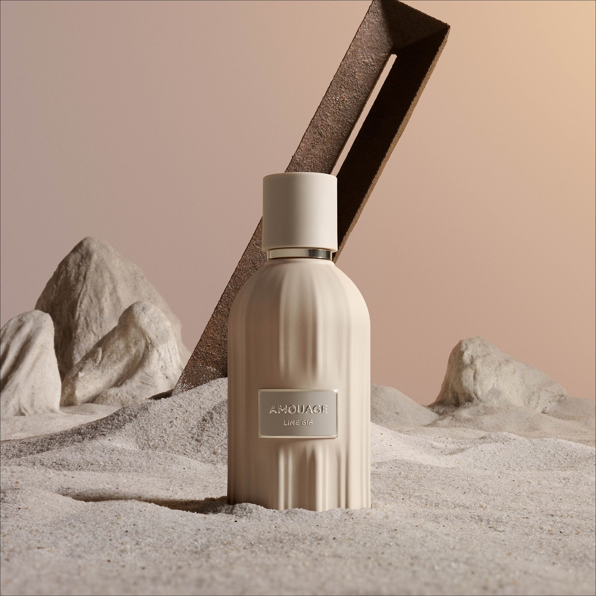 Amouage Line 618 Eau de Parfum bottle in a sculptural desert-inspired setting