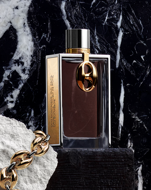 Rabanne OUD MONTAIGNE perfume bottle on a dark marble background